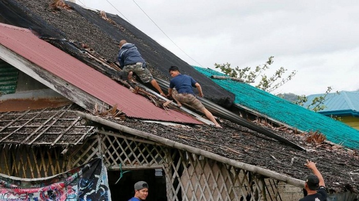 Philippines searches for 18 crewmen of ship sunk by typhoon 